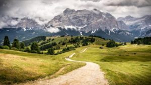 Path to snowy, rocky mountains